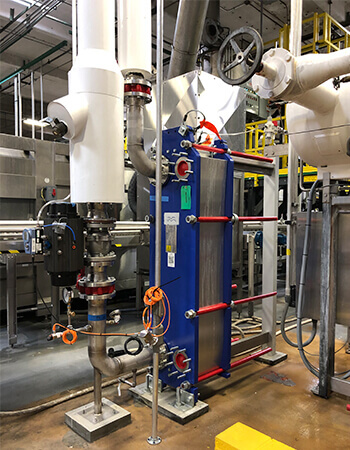 View inside Shambaugh's fabrication facility of a custom refrigeration piping system
