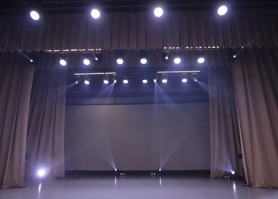 School auditorium with stage lights on